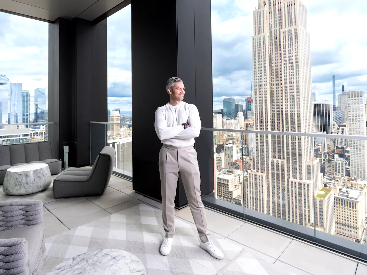 Ryan Serhant on a penthouse terrace above New York City