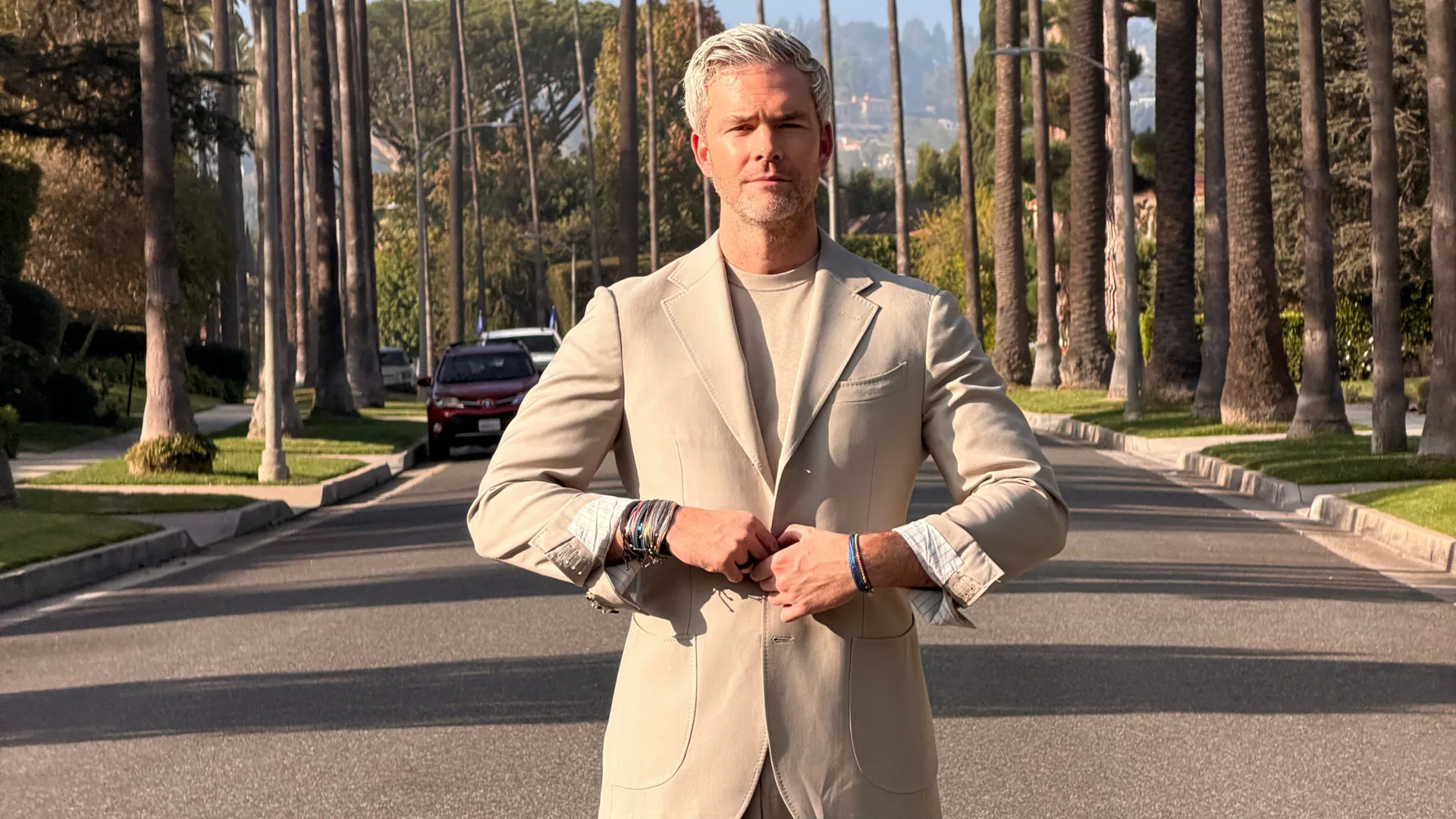 Ryan Serhant on a palm-lined California boulevard